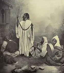 Image 12Snake charmingPhoto: Tancrède Dumas; Restoration: Lise BroerA late nineteenth century photo of snake charmers in Tangier, Morocco. Snake charming is the practice of apparently hypnotising a snake, and the performance may use musical instruments and other street performance techniques. The practice as it exists today probably arose in India, where it remains widely practiced, and spread throughout Southeast Asia, the Middle East, and North Africa.More selected pictures