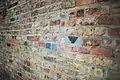 Brick Wall with a few colorful bricks