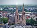 The church's twin spires rising high above their surrounding