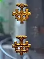 Hiddensee treasure. Golden jewellery mixing Thor's hammer and the Christian cross (10th century).