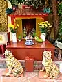 The shrine of Ông Tài - Ông Địa at Thánh Trần Temple