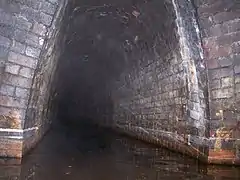 The Butterley Reservoir adit where it enters the Butterley Tunnel about 600 yards (550&nbsp;m) along the tunnel from the western portal in 2006