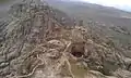 Top of the mountain showing half side of the fortification (Arabic: حِصْن ٱلْغُرَاب, romanized: Hiṣn Al-Ghurāb)