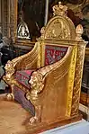 Empire throne; by Bernard Poyet and François-Honoré-Georges Jacob-Desmalter; 1805; carved and gilded wood, covered in red velvet with silver embroidery; 160 x 110 x 82&nbsp;cm; Musée des Arts Décoratifs