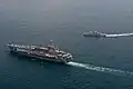 USS John C. Stennis and RSS Stalwart underway on 30 January 2012.