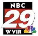 A red rectangle with black top and bottom. At the top are the letters N B C in a sans serif. Sitting over the red area and extending out from the frame is an italicized white 29. At the bottom are the letters W V I R, slightly off to the left to make room for the NBC peacock, which sits in the lower right and overlaps part of the "9".