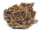 A plate of very sharp, chocolate-brown crystals of wulfenite to 1.5&nbsp;cm on edge