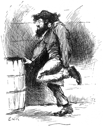 man standing clutching his ankle