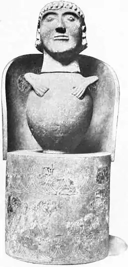 EB1911 Ceramics Fig. 65.—ETRUSCAN “CANOPIC” JAR PLACED IN BRONZE CHAIR.jpg