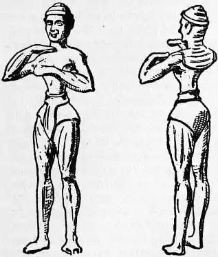 EB1911 Costume Fig. 16.—Lead Statuette from Kampos.jpg