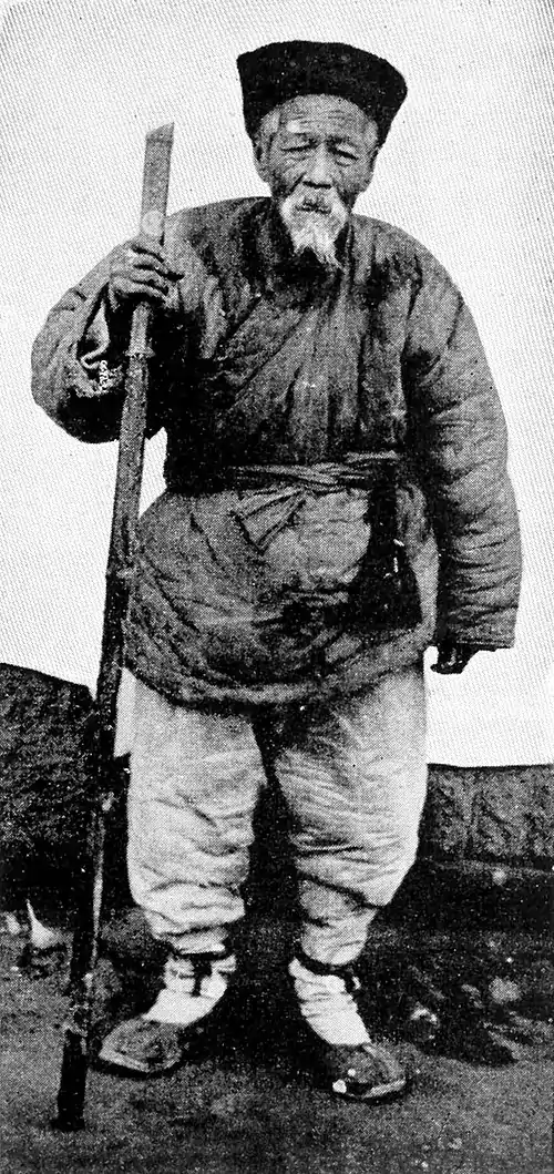 Farmers of forty centuries - Aged Chinese farmer in winter dress.jpg