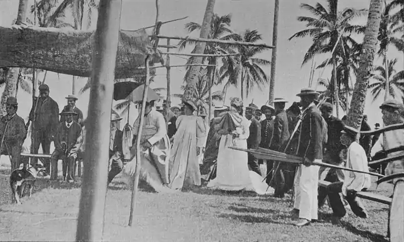 The King and Queen take their seats